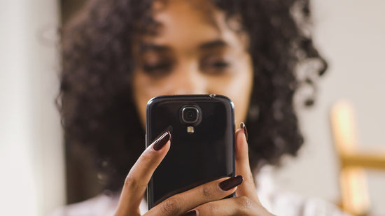 Woman holding mobile phone